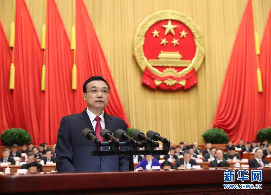 Chinese Premier Li Keqiang delivers a government work report during the opening meeting of the fifth session of China