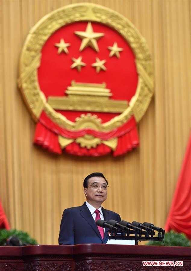 Chinese Premier Li Keqiang delivers a government work report during the opening meeting of the fifth session of China