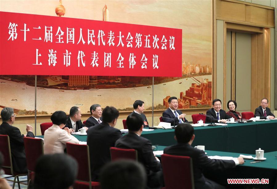 Chinese President Xi Jinping joins a panel discussion with deputies to the 12th National People