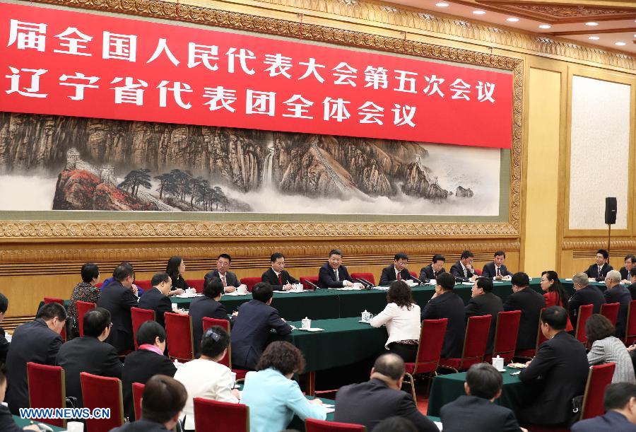 Chinese President Xi Jinping joins a panel discussion with deputies to the 12th National People