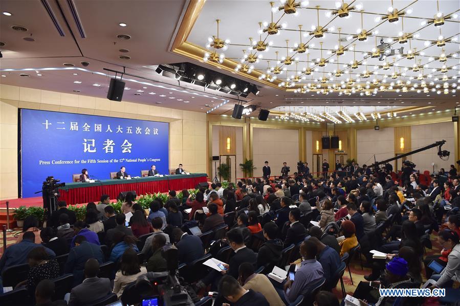 Chinese Science and Technology Minister Wan Gang and Secretary-General Xu Jianpei take questions on innovation-driven development at a press conference for the fifth session of the 12th National People