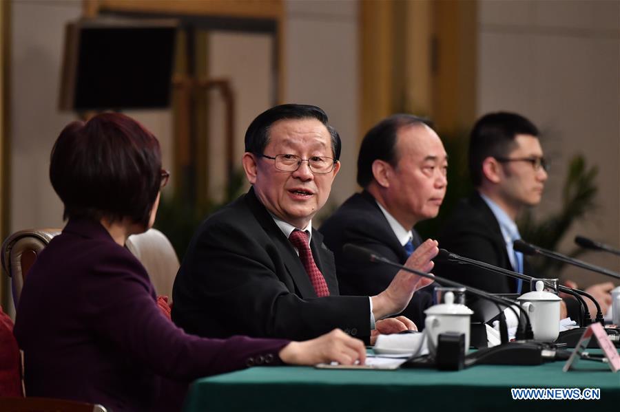 Chinese Science and Technology Minister Wan Gang (2nd L) answers questions on innovation-driven development at a press conference for the fifth session of the 12th National People