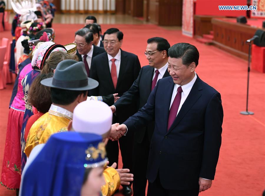 Top Communist Party of China and state leaders Xi Jinping, Li Keqiang, Zhang Dejiang, Yu Zhengsheng, Liu Yunshan, Wang Qishan and Zhang Gaoli attend a gathering with ethnic minority deputies to the 12th National People