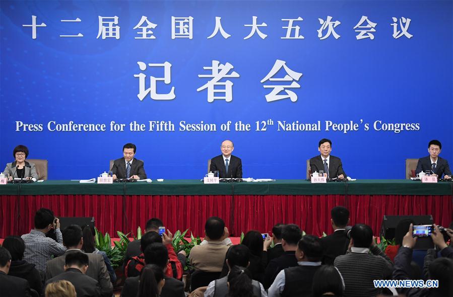 Zhi Shuping, director of the General Administration of Quality Supervision, Inspection and Quarantine, his deputy Sun Dawei, and Tian Shihong, head of the Standardization Administration of China, take questions at a press conference on quality improvement for the fifth session of the 12th National People