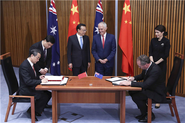 Premier Li Keqiang and Australian Prime Minister Malcolm Turnbull witnessed the signing of eight cooperation documents at Parliament House in Canberra on March 24.