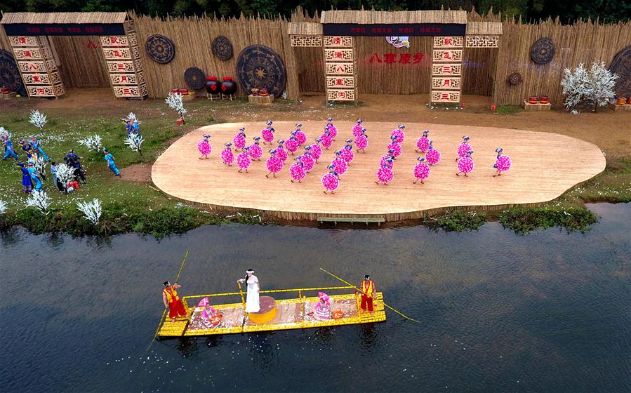 Dancers perform at a celebration of "Sanyuesan" festival in Qinzhou, south China