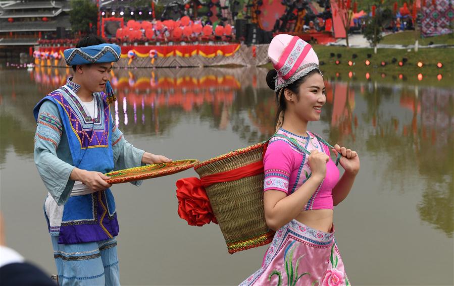 Dancers perform at a celebration of "Sanyuesan" festival in Nanning, capital of south China