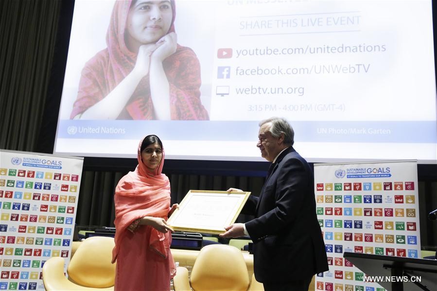 United Nations Secretary-General Antonio Guterres (R) designates Malala Yousafzai as the UN Messenger of Peace with a special focus on girls