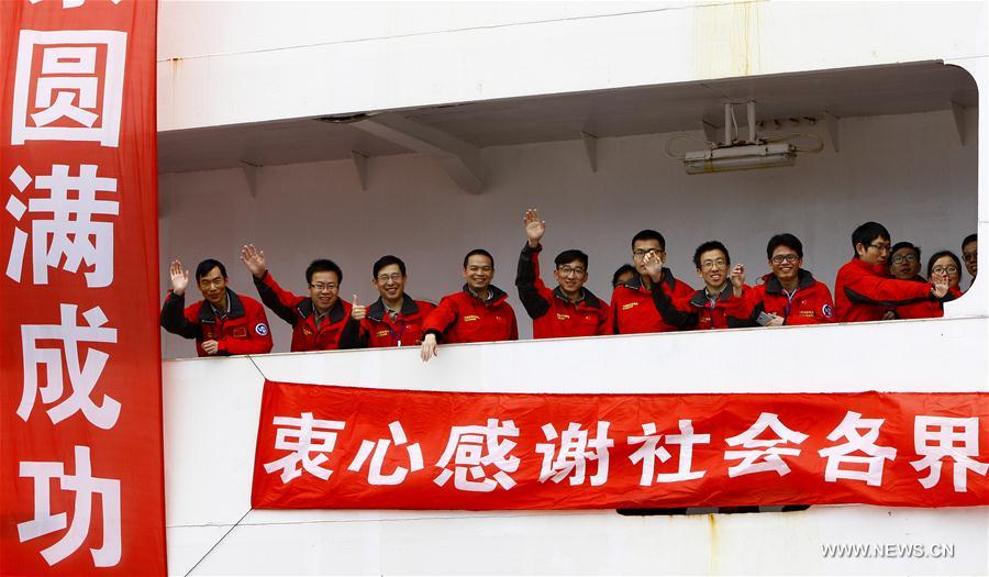 Members of the Chinese scientific expedition team wave after returning to Shanghai, east China, April 11, 2017. Chinese scientists concluded a 161-day expedition, the 33rd of its kind, to Antarctica on the Xuelong icebreaker and returned to Shanghai on Tuesday. (Xinhua/Fang Zhe) 