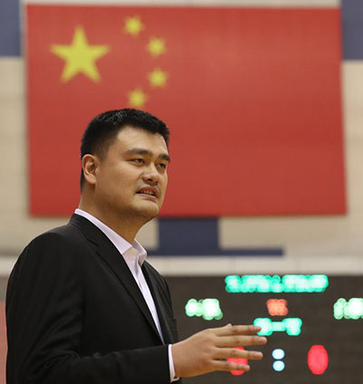 Chairman of the Chinese Basketball Association Yao Ming speaks after an open training class of Chinese women