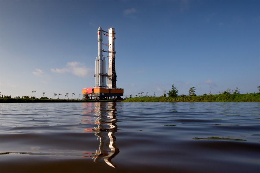 Photo taken on April 17, 2017 shows the cargo spacecraft Tianzhou-1 being transferred with a Long March-7 Y2 carrier rocket from the testing center to the launch zone in Wenchang, south China