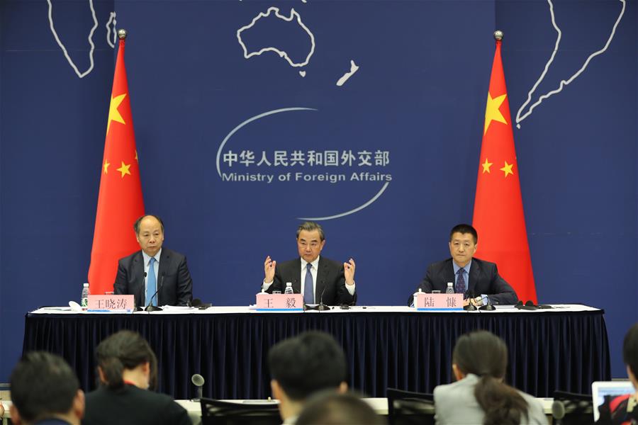 Chinese Foreign Minister Wang Yi (C) and Wang Xiaotao (L), deputy head of the National Development and Reform Commission, attend a press conference on the Belt and Road Forum for International Cooperation in Beijing, capital of China, April 18, 2017. The Belt and Road Forum for International Cooperation will be held from May 14 to 15 in Beijing and Chinese President Xi Jinping will attend the opening ceremony and host the round table summit of the leaders, Wang Yi said on Tuesday. At the invitation of Xi, 28 heads of state and government leaders will attend the forum. (Xinhua/Xing Guangli)