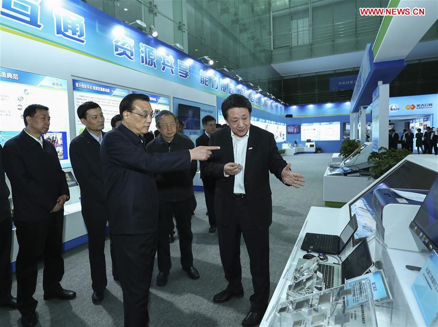 Chinese Premier Li Keqiang (C, front) inspects China Aerospace Science and Industry Corporation (CASIC) in Beijing, capital of China, April 27, 2017. (Xinhua/Xie Huanchi)