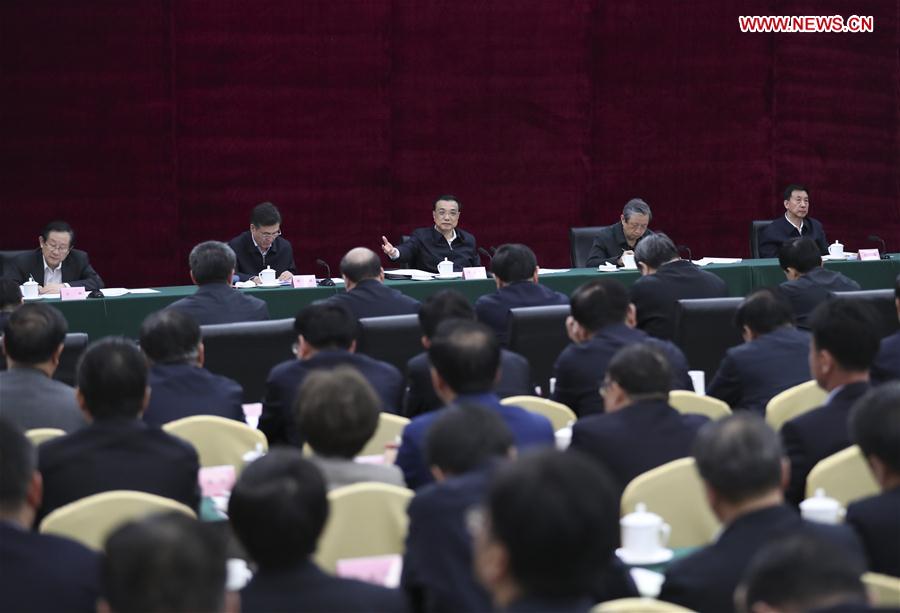 Chinese Premier Li Keqiang (C, rear) presides over a meeting on state-owned enterprises under direct administration of central government as he inspects China Aerospace Science and Industry Corporation (CASIC) in Beijing, capital of China, April 27, 2017. (Xinhua/Xie Huanchi)