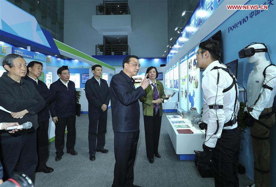 Chinese Premier Li Keqiang (C, front) inspects China Aerospace Science and Industry Corporation (CASIC) in Beijing, capital of China, April 27, 2017. (Xinhua/Xie Huanchi)