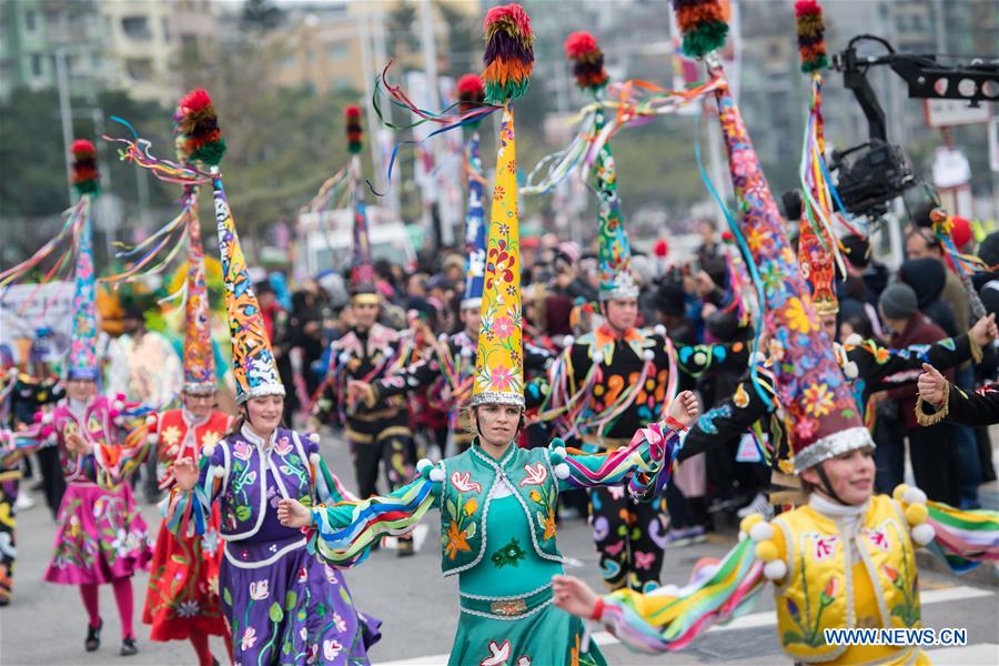 Performers take part in the Macao International Parade in Macao, south China, Dec. 17, 2017. The parade was held here on Sunday to mark the 18th anniversary of Macao