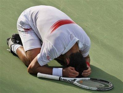 Serbia's Novak Djokovic reacts after defeating Russia's Mikhail Youzhny at the final match of Dubai ATP Tennis Championship in Dubai, United Arab Emirates, Sunday, Feb. 28, 2010. (AP Photo/Kamran Jebreili) 