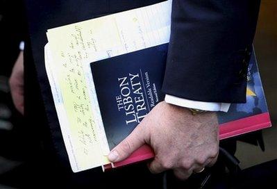 FILE - In this Tuesday Sept. 29, 2009 file photo Declan Ganley, leader of Euro-skeptic party Libertas, holds a copy of 'The Lisbon Treaty: The Readable Version' in Dublin, Ireland. On Tuesday Nov. 3, 2009 the Czech constitutional court ruled that the Lisbon Treaty is in line with the constitution, clearing the way for President Vaclav Klaus to sign it.(AP Photo/Peter Morrison, File)