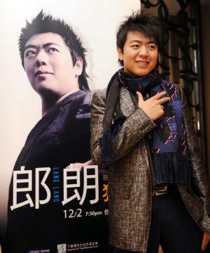 Lang Lang poses for photos at the press conference in Taipei, southeast China's Taiwan Province, Nov. 30, 2009. Lang Lang Charity Concert will be held at Taipei Arena on Dec. 2, and all the tickets sales will be donated for the rebuilding construction damaged by Typhoon Morakot in August.[Photo: Xinhua]