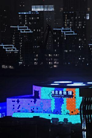 Photo taken on Dec. 30, 2009 shows the Informations and Communications Pavilion inside the Puxi zone of the 2010 Shanghai World Expo Park, part of the main buildings of 2010 Shanghai World Expo Park, being set on trial adjustment of overall illumination, in Shanghai, east China's Metropolis. (Xinhua/Guo Changyao)