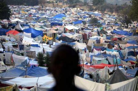 A boy stands at a makeshift camp at a golf course in Port-au-Prince, Haiti January 26, 2010.(Xinhua/Reuters Photo)