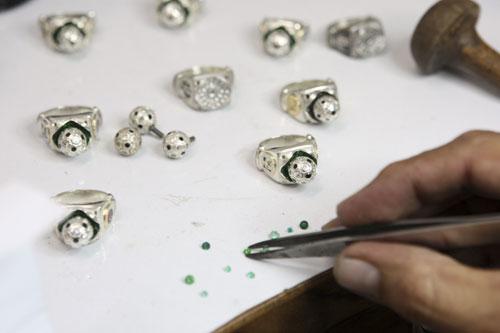 A jeweller works on FIFA 2010 World Cup rings at a jewellery workshop in Bucaramanga April 22, 2010. A group of Colombian jewellers are producing platinum and gold rings that will be part of an exclusive jewellery collection approved by FIFA for the 2010 World Cup in South Africa. The rings, made with emeralds and diamonds from South Africa, will sell from between $2,500 to $250,000. Picture taken April 22, 2010.(Xinhua/Reuters Photo)