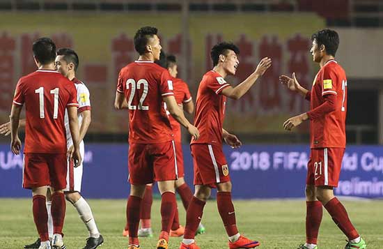 Chinese players react during a game against Qatar in Xi’an on Tuesday, March 29, 2016. 