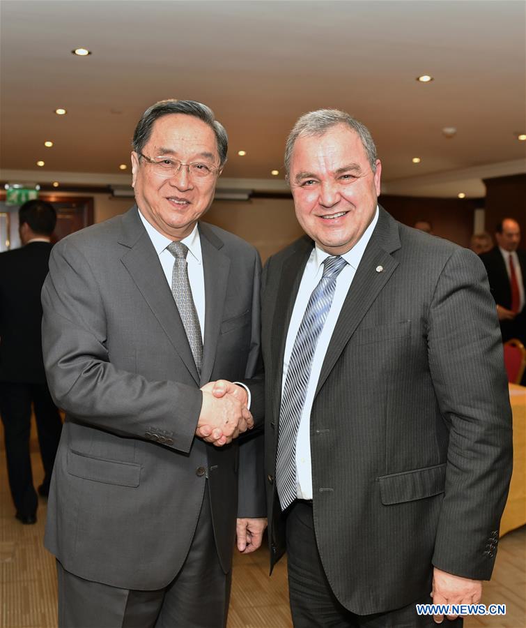 Yu Zhengsheng (L), chairman of the National Committee of the Chinese People