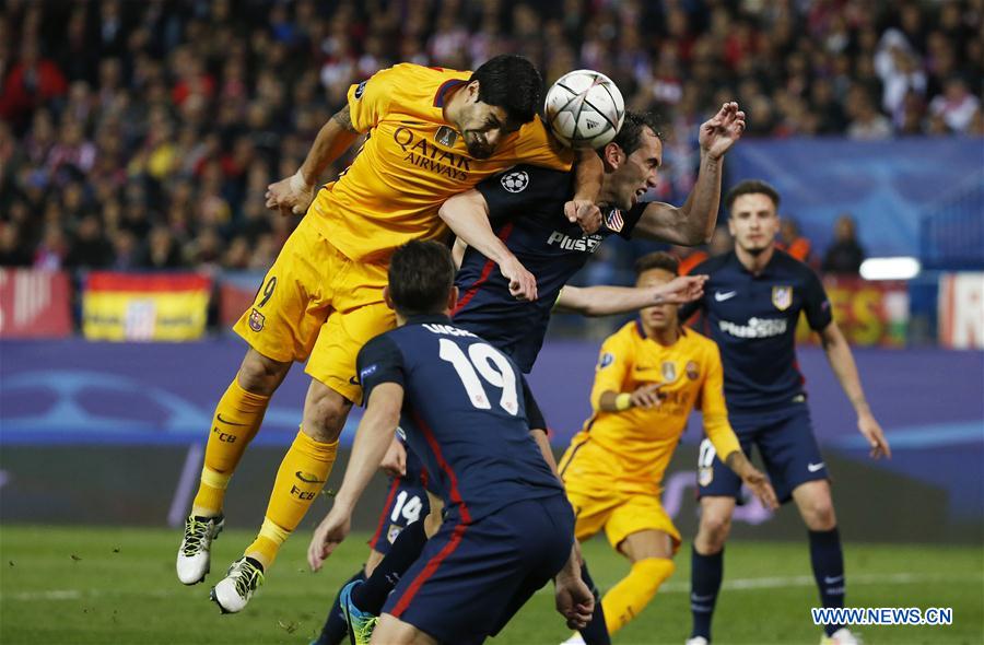Luis Suarez (L) of FC Barcelona vies for the ball during the match on April 14, 2016. Atletico Madrid defeated reigning champions FC Barcelona 2-0 on the night and 3-2 on aggregate to book their place in the semi-finals of the Champions League. (Source: Xinhua/Reuters)