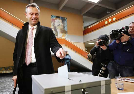 The candidat of the far-right Freedom Party Norbert Hofer drops his ballot at the polling station at the first round of presidental elections on April 24, 2016 in Pinkafeld, Austria.