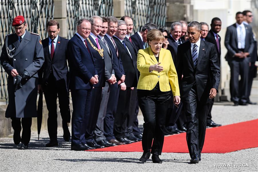 HANNOVER, April 24, 2016 (Xinhua) -- Visiting U.S. President Barack Obama (front R) and German Chancellor Angela Merkel (front L) attend a welcome ceremony in Hannover, Germany, on April 24, 2016. (Xinhua/Zhang Fan) 