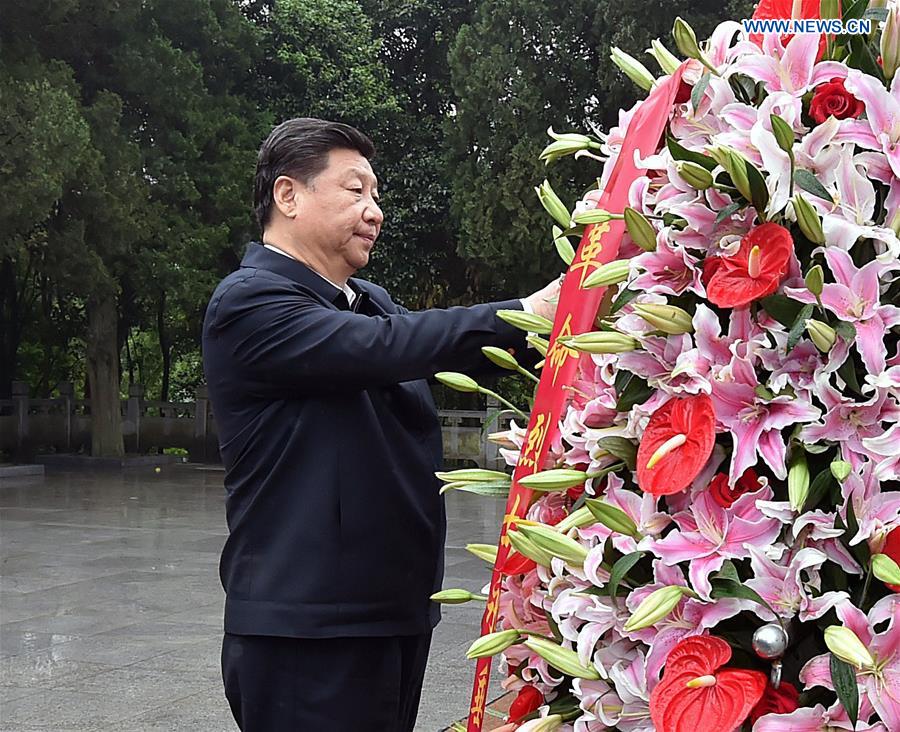 HEFEI, April 27, 2016 (Xinhua) -- Chinese President Xi Jinping lays a flower basket to the revolutionary martyrs monument on the Red Army Square in Jinzhai County, Liuan City, east China