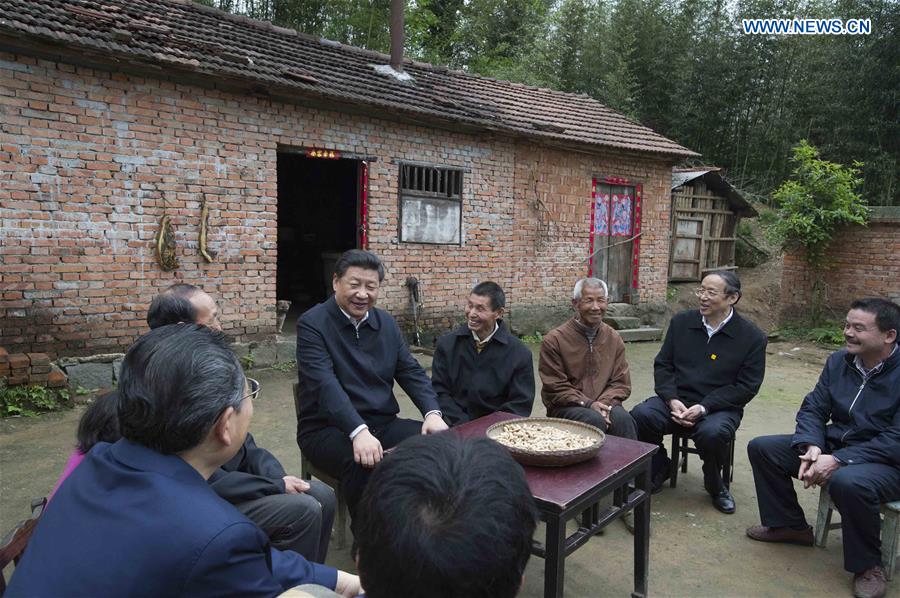 HEFEI, April 27, 2016 (Xinhua) -- Chinese President Xi Jinping talks with villagers on poverty alleviation work in Dawan Village of Huashi Township in Jinzhai County, Liuan City, east China