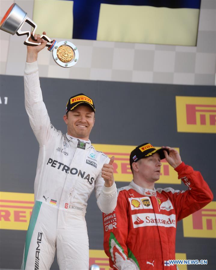 SOCHI, May 2, 2016 (Xinhua) -- German Mercedes driver Nico Rosberg celebrates with his trophy during the awarding ceremony after winning the Formula One Russian Grand prix in Sochi May 1, 2016. (Xinhua/Pavel Bednyakov) 