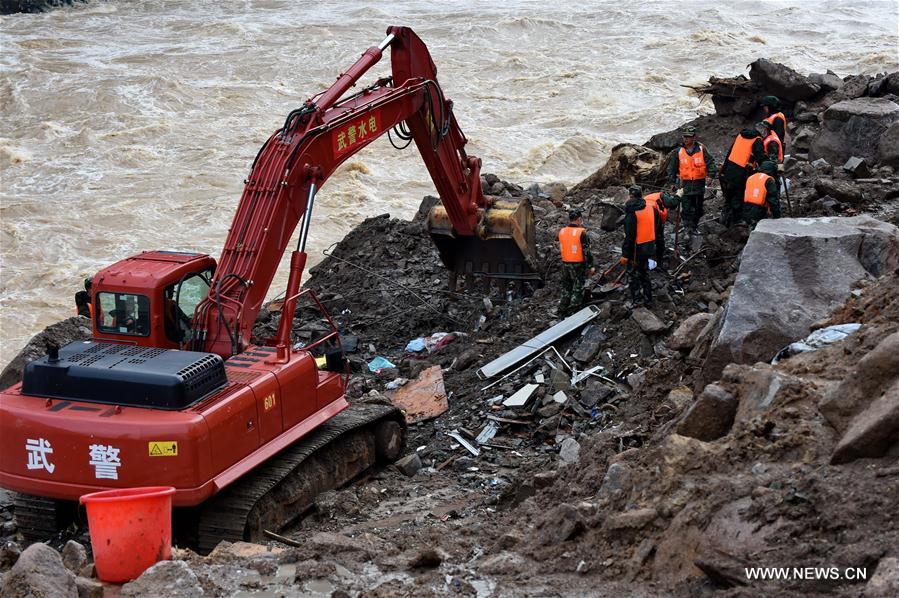 TAINING, May 9, 2016 (Xinhua) -- Rescuers search at the landslide site in Taining County, southeast China