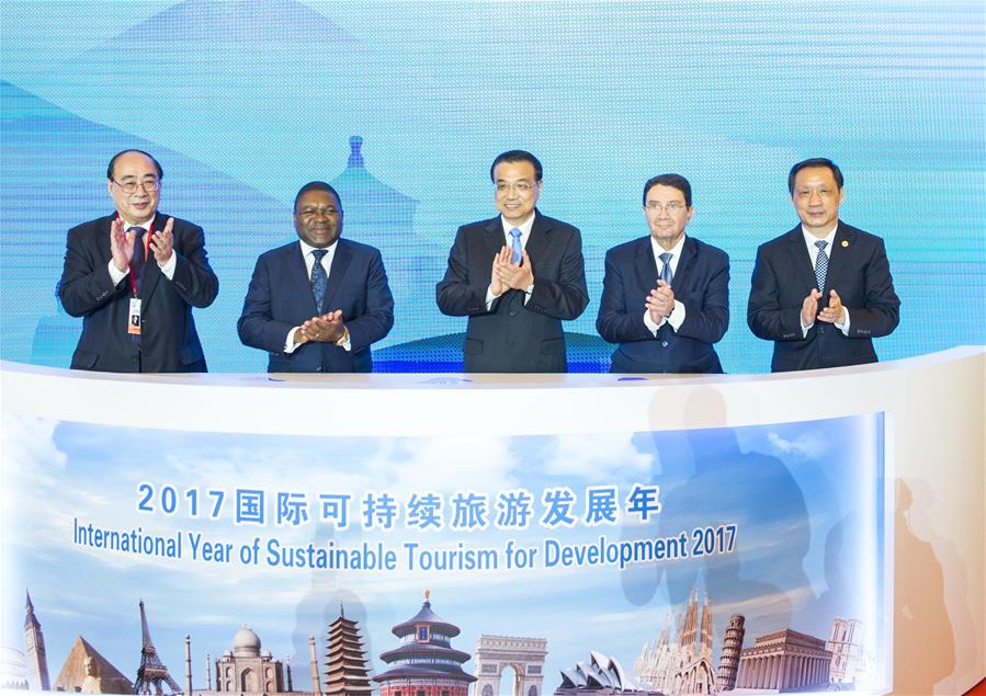 Chinese Premier Li Keqiang (C) attends the opening ceremony of the First World Conference on Tourism for Development in Beijing, capital of China, May 19, 2016. (Xinhua/Wang Ye)