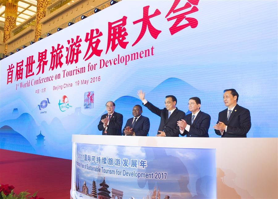 Chinese Premier Li Keqiang (C) attends the opening ceremony of the First World Conference on Tourism for Development in Beijing, capital of China, May 19, 2016. (Xinhua/Xie Huanchi)