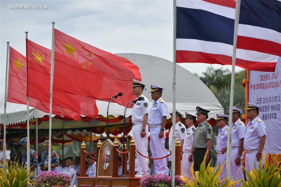 SATTAHIP, May 21, 2016 (Xinhua) -- Wang Hai (L, Front), deputy commander of Chinese Navy, and Royal Thai Navy Fleet Commander Naris Prathumsuwan (R, Front) review troops during the opening ceremony for a joint military exercise in Sattahip Naval Base, Chon Buri province, Thailand, on May 21, 2016. Thai and Chinese marine corps held an opening ceremony for a joint military exercise codenamed Blue Strike 2016 here on Saturday. (Xinhua/Li Mangmang)