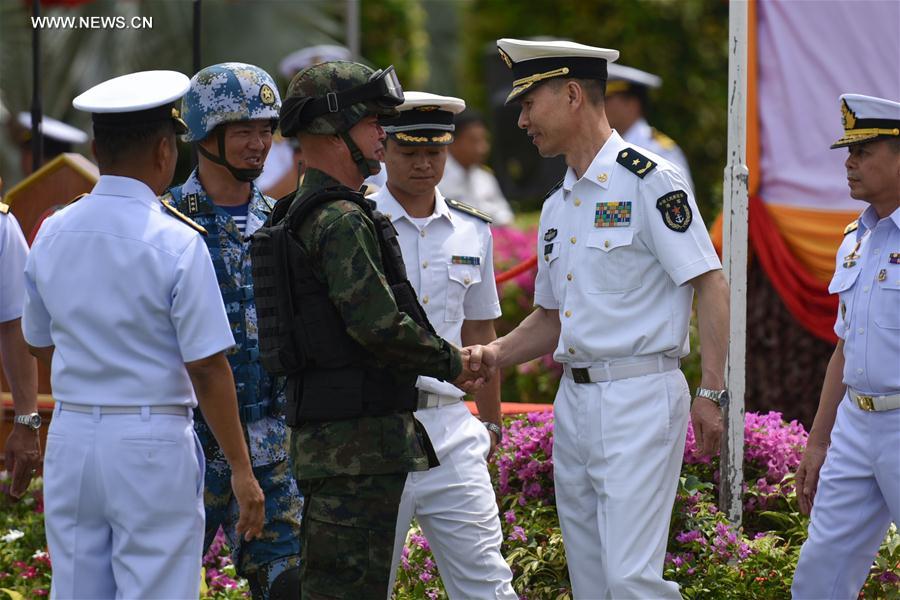 SATTAHIP, May 21, 2016 (Xinhua) -- Wang Hai (R, Front), deputy commander of Chinese Navy, shakes hands with a Thai marine during the opening ceremony for a joint military exercise in Sattahip Naval Base, Chon Buri province, Thailand, on May 21, 2016. Thai and Chinese marine corps held an opening ceremony for a joint military exercise codenamed Blue Strike 2016 here on Saturday. (Xinhua/Li Mangmang)