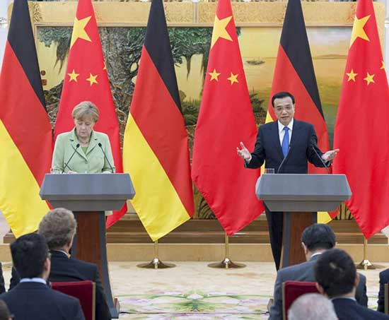 Chinese Premier Li Keqiang holds a joint press conference with visiting German Chancellor Angela Merkel here in Beijing. 