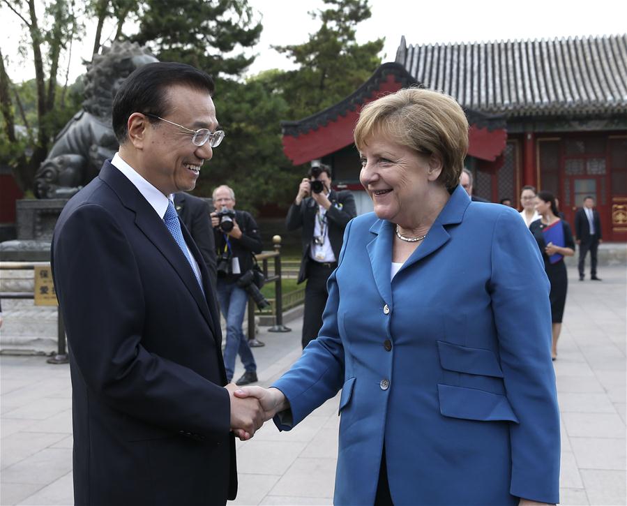 BEIJING, June 12, 2016 (Xinhua) -- Chinese Premier Li Keqiang (L) meets with German Chancellor Angela Merkel on her visit to China for the fourth round of China-Germany intergovernmental consultation in Beijing, capital of China, June 12, 2016. (Xinhua/Pang Xinglei)