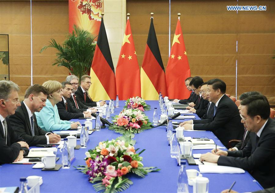 BEIJING, June 13, 2016 (Xinhua) -- Chinese President Xi Jinping meets with German Chancellor Angela Merkel in Beijing, capital of China, June 13, 2016. (Xinhua/Liu Weibing) 