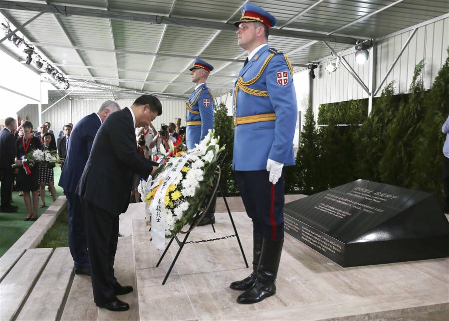 BELGRADE, June 17, 2016 (Xinhua) -- Chinese President Xi Jinping and his wife Peng Liyuan pay homage to the Chinese martyrs killed in the NATO bombing of the former Chinese embassy in the Federal Republic of Yugoslavia in May 1999, after arriving in Belgrade for a state visit to Serbia, June 17, 2016. The three martyrs were journalists Shao Yunhuan of Xinhua News Agency, and Xu Xinghu and his wife Zhu Ying, of the Guangming Daily newspaper. (Xinhua/Lan Hongguang)
