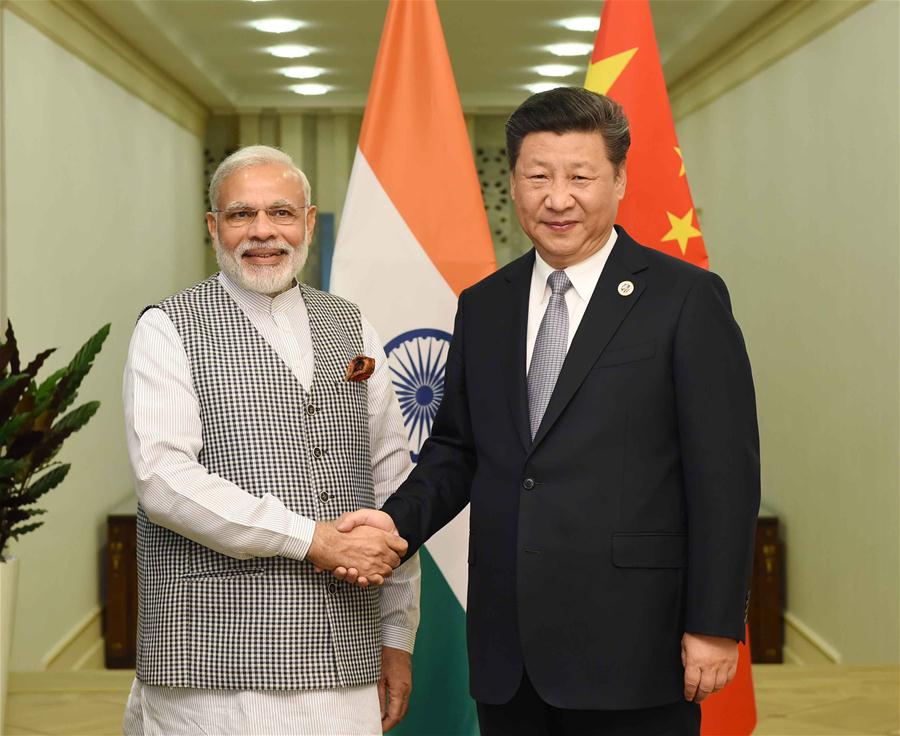 Chinese President Xi Jinping (R) meets with Indian Prime Minister Narendra Modi in Tashkent, Uzbekistan, June 23, 2016. (Xinhua/Rao Aimin) 