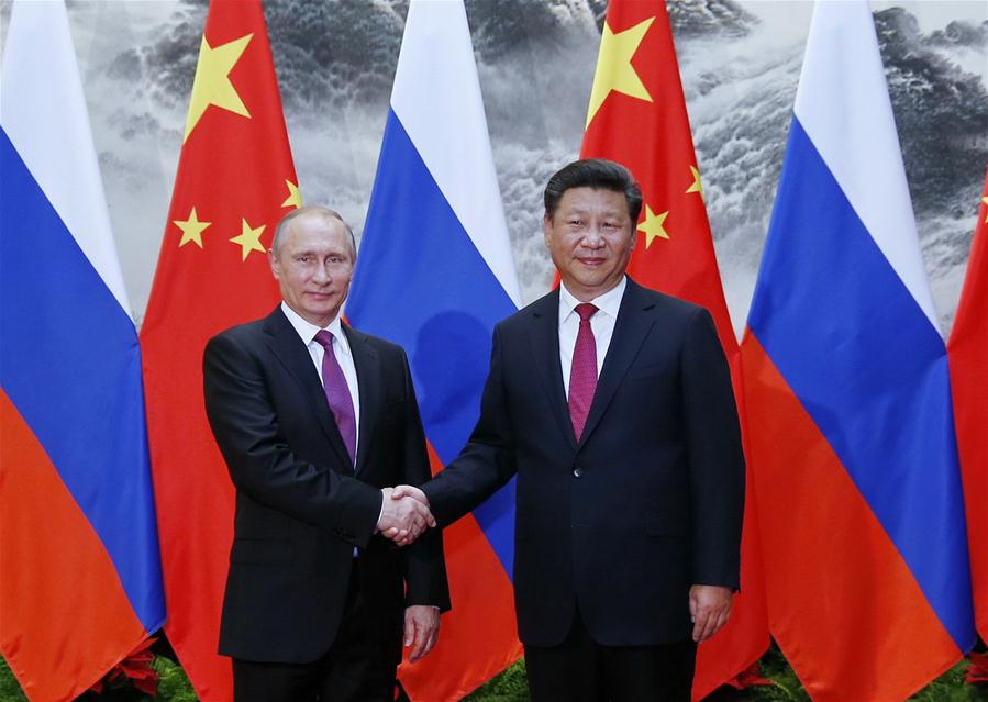 BEIJING, June 25, 2016 (Xinhua) -- Chinese President Xi Jinping (R) shakes hands with Russian President Vladimir Putin at the Great Hall of the People in Beijing, capital of China, June 25, 2016. (Xinhua/Ju Peng) 