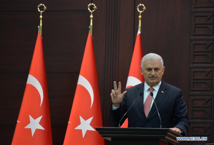 Turkish Prime Minister Binali Yildirim delivers a speech during a press conference after a Turkish-Israeli meeting, in Ankara, Turkey, on June 27, 2016. Turkey and Israel have reached a deal to normalise ties and the two countries will exchange ambassadors, Turkish Prime Minister Binali Yildirim said on Monday, after a six-year diplomatic rift. (Xinhua/Mustafa Kaya) 