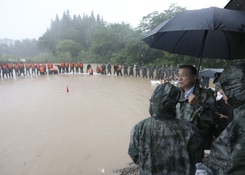 Chinese Premier Li Keqiang joins disaster relief efforts in heavy rain in Wuhan, in central China