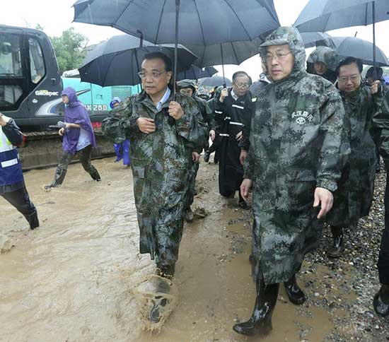 Chinese Premier Li Keqiang joins disaster relief efforts in heavy rain in Wuhan, in central China