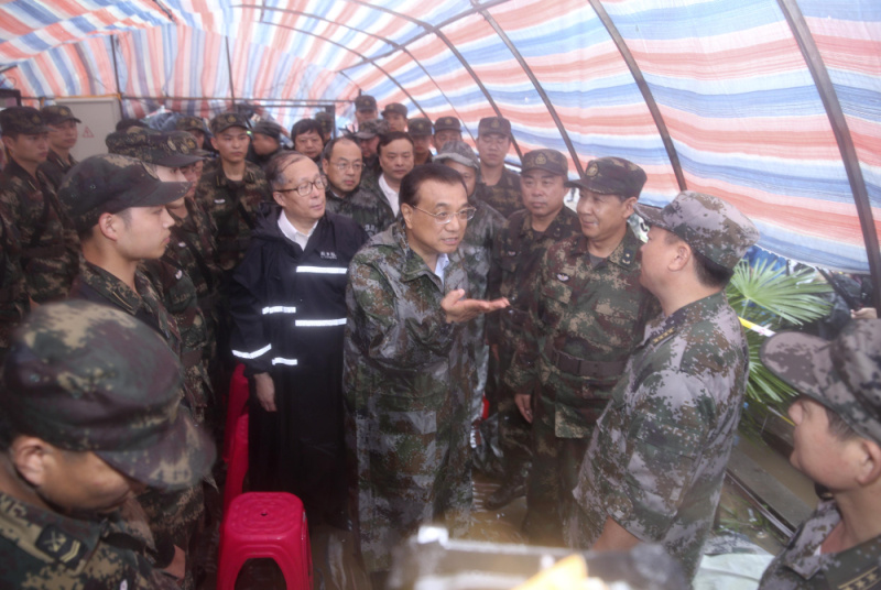 Chinese Premier Li Keqiang joins disaster relief efforts in heavy rain in Wuhan, in central China