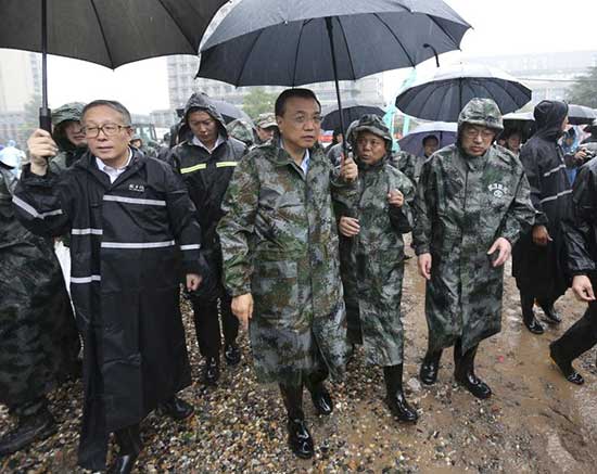 Chinese Premier Li Keqiang joins disaster relief efforts in heavy rain in Wuhan, in central China